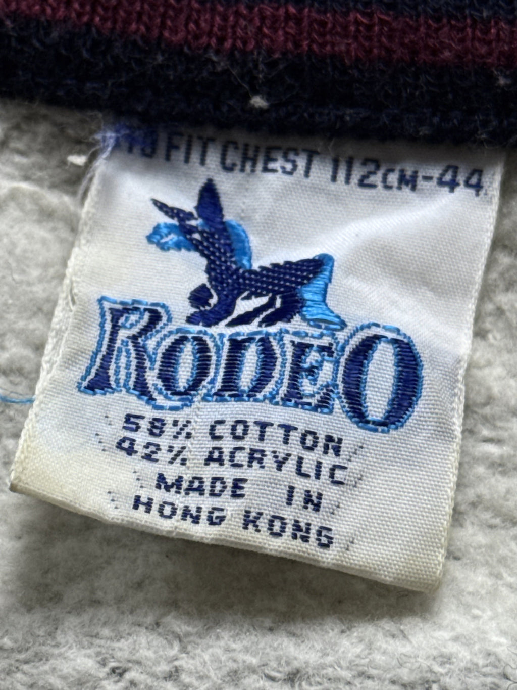 Vintage 1980's Rodeo Fleece Lined Raglan Sleeve Stripe Collar Track Sweatshirt.