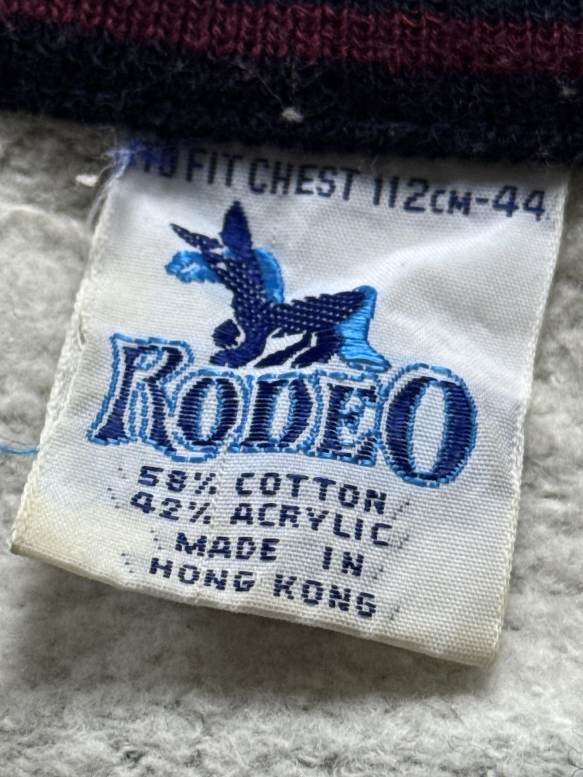 Vintage 1980's Rodeo Fleece Lined Raglan Sleeve Stripe Collar Track Sweatshirt.