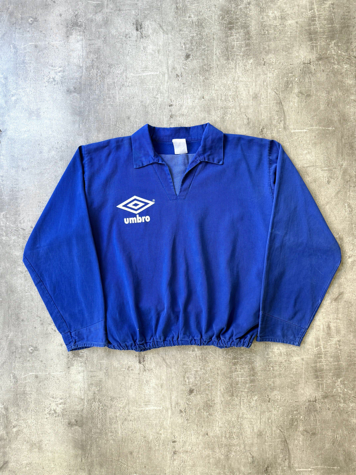 Vintage 1980's Umbro Royal Blue Pullover Graphic Drill Smock.