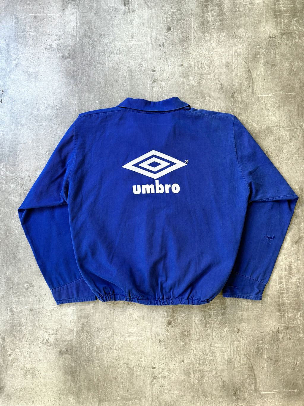 Vintage 1980's Umbro Royal Blue Pullover Graphic Drill Smock.